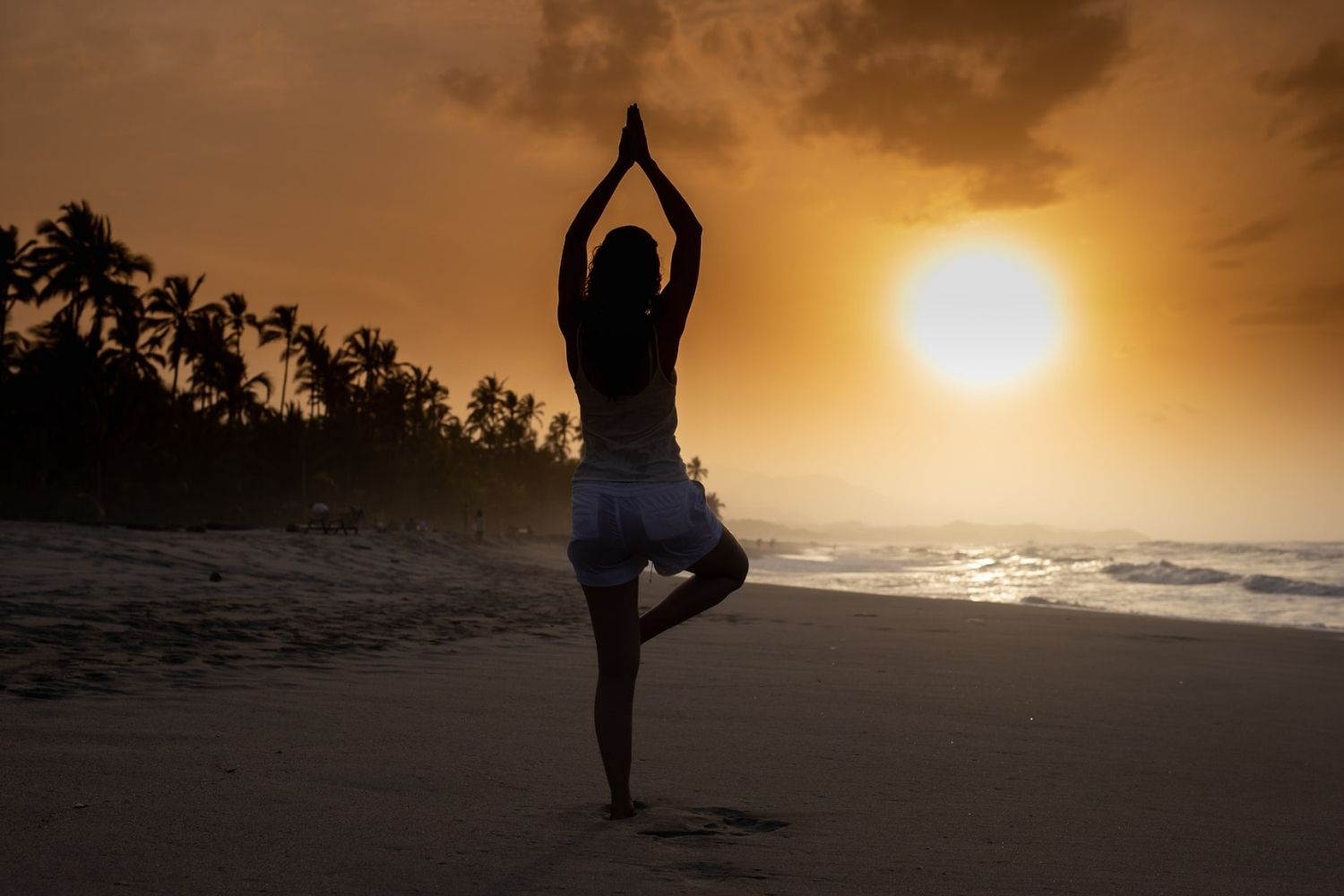 Flexible woman doing yoga on beach - a Royalty Free Stock Photo from  Photocase