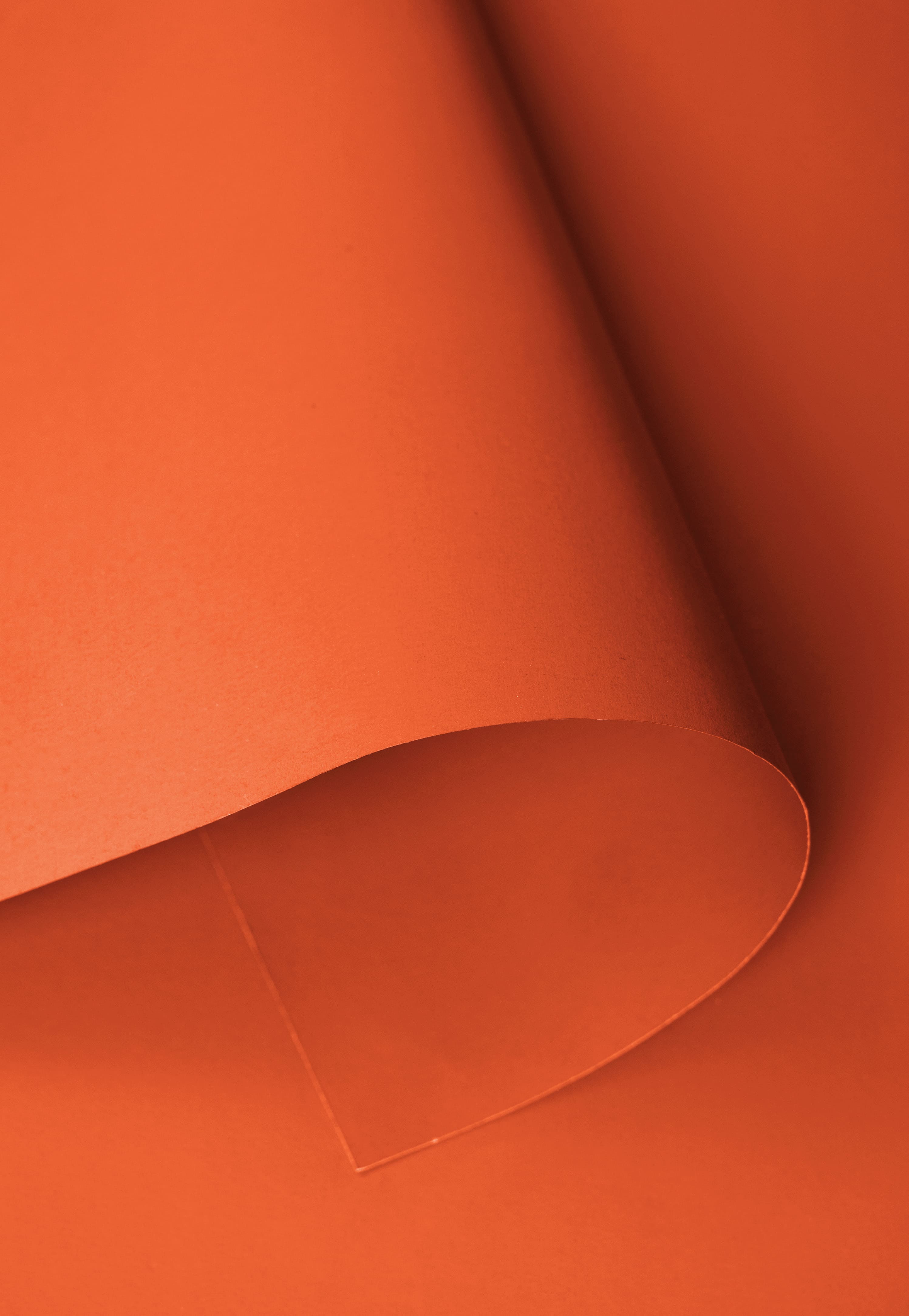 Fondo de papel naranja brillante sin costuras para fotografía