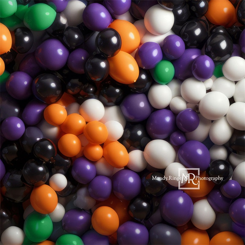 Fondo de pared de globos morado, naranja, negro y verde diseñado por Mandy Ringe Photography